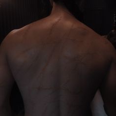 the back of a man with no shirt on