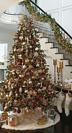 a decorated christmas tree with gold and red ornaments