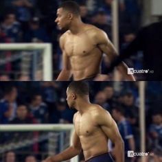 a man with no shirt on standing in front of a soccer field and looking off to the side