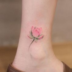 a small pink flower on the ankle