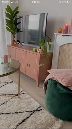 a living room filled with furniture and a flat screen tv on top of a wooden stand