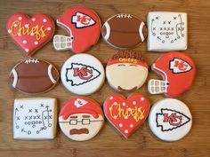 decorated cookies are arranged in the shape of footballs, helmets, and other sports related items