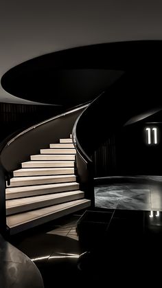 a staircase leading up to the top of a set of stairs in a black and white photo