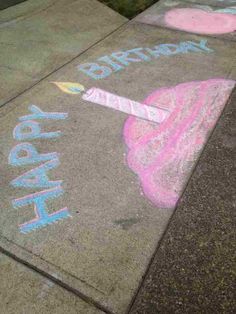 the sidewalk has chalk writing on it that says happy birthday and an ice cream cone