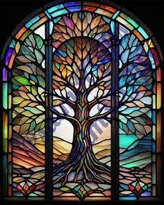 a stained glass window with a tree in it