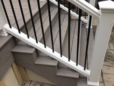 a close up view of a stair railing and handrail on a home's front porch