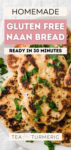 homemade gluten free naan bread on a white plate with parsley leaves