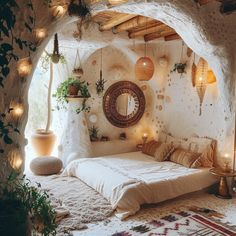 a bed room with a neatly made bed surrounded by potted plants and lights on the walls