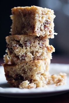 three pieces of cake sitting on top of a white plate