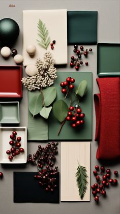 various items are arranged on top of each other, including red and green accents such as holly berries