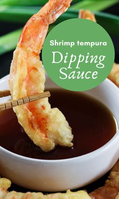 shrimp tempura dipping sauce in a white bowl with chopsticks sticking out