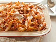 a casserole dish filled with pasta and sauce