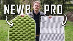 a man holding up an inflatable mattress with the words new pro above it