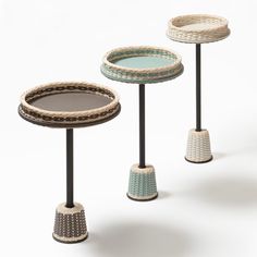 three small tables with different designs on them