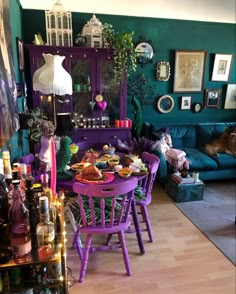 a living room filled with furniture and lots of clutter on top of the table