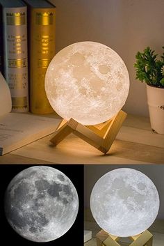 the moon lamp is sitting on top of a wooden stand