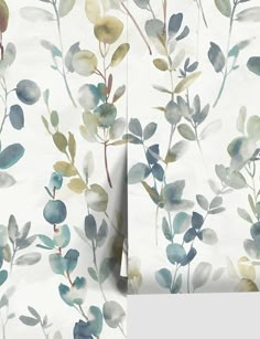 a wallpaper with blue and green leaves on it