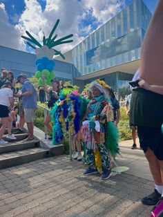 some people are dressed up in costumes and standing on the steps outside an office building