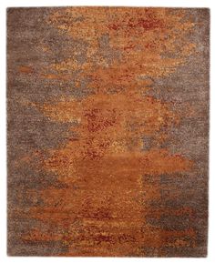 an orange and brown rug with different colors