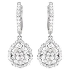 An exquisite array of diamonds totaling 1.0 carats make these elegant, understated earrings incredibly impressive. The perfect way to add a touch of luxury to any occasion, each one features an 18K white gold setting that measures 1.0 long by 0.45 wide.This jewelry piece is offered in brand new condition and includes a gift box. Triple Ring, White Gold Set, Luxury Earrings, Circle Diamond, Diamond Drops, Diamond Drop Earrings, Modern Earrings, Sparkle Diamonds, Diamond Stone