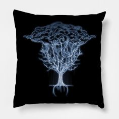 a black pillow with a white tree on the front and blue lights in the back