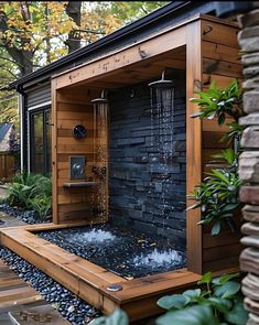 an outdoor shower with water coming out of it