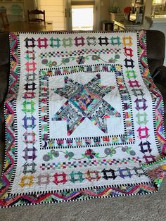 a quilt on a chair in a living room