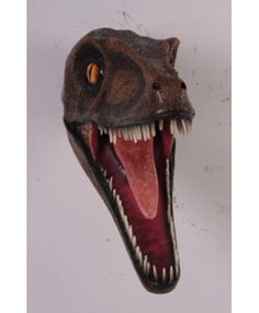 the head of a dinosaur with its mouth open