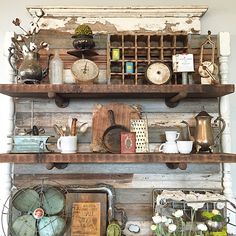 the shelves are filled with old items and pots, pans, and other kitchen utensils