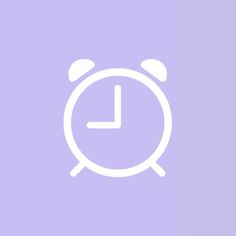 an alarm clock on a purple background