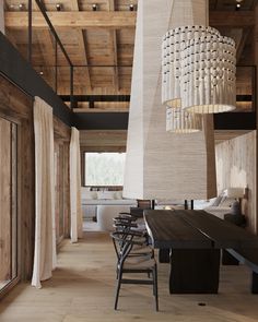 a dining room table with chairs and a chandelier hanging from it's ceiling