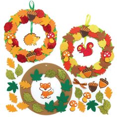 an assortment of fall crafts including wreaths, leaves and acorns on a white background