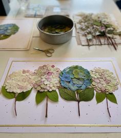 paper flowers are laid out on a table