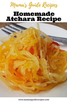 a white plate topped with sliced up yellow onions and carrots next to a fork