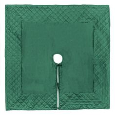 a green quilted square with a button on the center