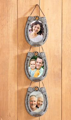 three hanging photo frames on a wooden wall