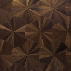 a wooden wall with many different shapes and sizes on it's sides, including triangles