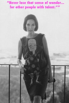 a woman standing on top of a balcony next to a sign that says, never lose that sense of wonder for other people with talent