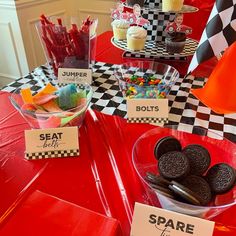 a red table topped with lots of desserts