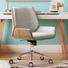 an office chair sitting on top of a wooden desk next to a white and gray rug