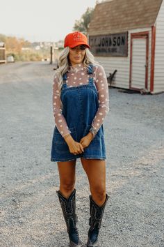 Get ready for fall with The Daisy Mesh Top! This playful layering piece features a small daisy print and long sleeves to keep you warm in style. The white color adds a touch of freshness to any outfit. Perfect for adding a quirky touch to your wardrobe! One size fits all. Courtney is wearing size small paired with The Etta Dress and American Cowgirl Trucker Country Concert Outfit Fall Midsize, Mini Cowboy Boots Outfit, Fall Country Music Concert Outfit, California Western Style, Western Denim Jumpsuit Outfit, Knee High Boots Outfit Western, Flatland Calvary Concert Outfit, Denim Dress Concert Outfit, Modest Nashville Outfits