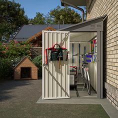 an open door to a storage shed with bicycles in it