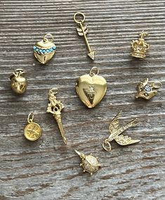 These are retired charms from a charm necklace. The stones are CZ and the gold vermeil is bright with no loss. I have added sturdy gold filled jump rings. They have all stones intact. All charms are 3D and sparkle! Gold-plated Charm Necklaces With Dangling Charms, Gold Plated Charm Necklaces With Dangling Charms, Gold Heart Charms For Jewelry Making, Gold-plated Charm Necklace With Dangling Charms, Dainty Gold Charm Necklaces, Dainty Gold Charm Necklace With Dangling Charms, Gold Heart-shaped Jewelry With Charms, Gold Plated Pendant Charms With Removable Features, Gold-plated Charms With Removable Features