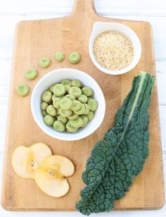 an assortment of food is displayed on a cutting board