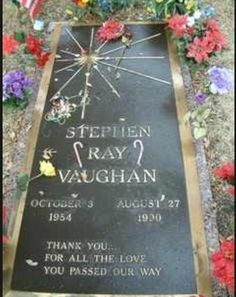 the grave of stephen ray vaughan is surrounded by flowers