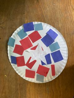 a paper plate that has some colored squares on it