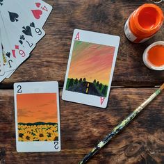 This painting consists of 2 cards on which I have designed a Sunflower and Sunset! Draw On Playing Cards, Play Cards Art, Painting Playing Cards Ideas Aesthetic, Hand Painted Playing Cards, Painting On Cards Deck Ideas, Painted Card Deck