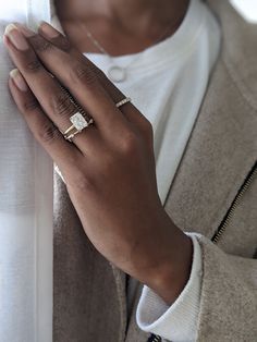 a close up of a person wearing a ring