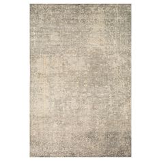 an area rug with grey and beige tones