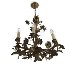 a chandelier with five lights hanging from it's center and leaves on the bottom